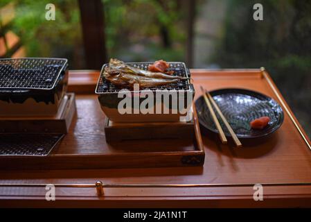 Fried fish being prepared in restaurant, Japan Stock Photo