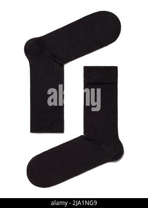 Black mans socks for clothing laying isolated on white background. Stock Photo