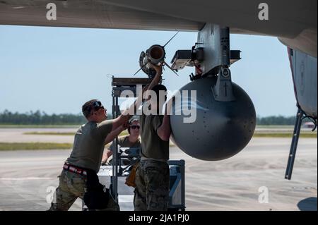 May 12, 2022 - Tyndall Air Force Base, Florida, USA - U.S. Airmen with the 104th Aircraft Maintenance Squadron, Barnes Air National Guard Base, Massachusetts, load an AIM-120 Advanced Medium-Range, Air-to-Air missile onto an F-15C Eagle during Checkered Flag 22-2 at Tyndall Air Force Base, Florida, May 12, 2022. Checkered Flag is a large-force aerial exercise held at Tyndall which fosters readiness and interoperability through the incorporation of 4th- and 5th-generation aircraft during air-to-air combat training. The 22-2 iteration of the exercise was held May 9-20, 2022. (Credit Image: © U.S Stock Photo