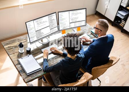 African American Programmer Woman Coding On Computer Stock Photo