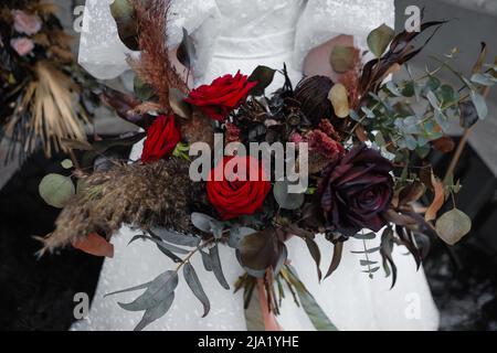 Wedding bouquet of black dried flowers. Wedding decor. Stock Photo