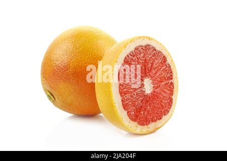 Whole and sliced grapefruit isolated on white background Stock Photo