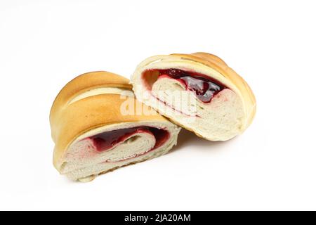 Sliced sweet pastry stuffed with fruity filling and isolated on white background Stock Photo