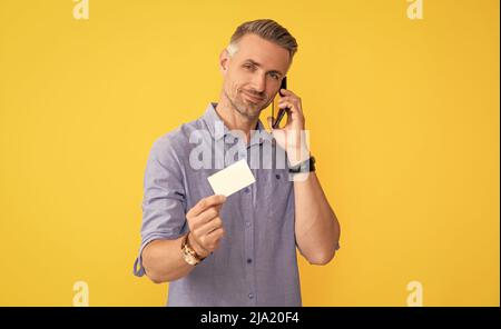 guy speak on smartphone. customer use online money on mobile phone. Stock Photo