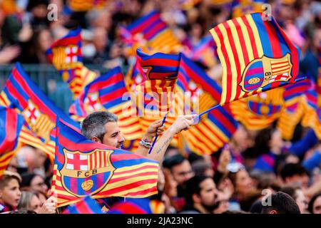 BARCELONA - APR 22: Fans waving flags during the UEFA Women's Champions League match between FC Barcelona and VfL Wolfsburg at the Camp Nou Stadium on Stock Photo