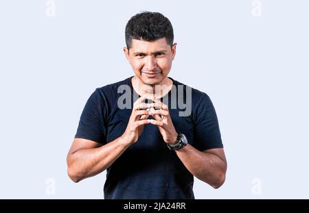 Person rubbing his hands planning something, Cunning man rubbing his hands on isolated background, concept of cunning man planning something Stock Photo