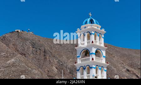 Blue and white bell tower, church, blue cloudless sky, radar station on mountain, Perissa, Santorini Island, Cyclades, Greece Stock Photo