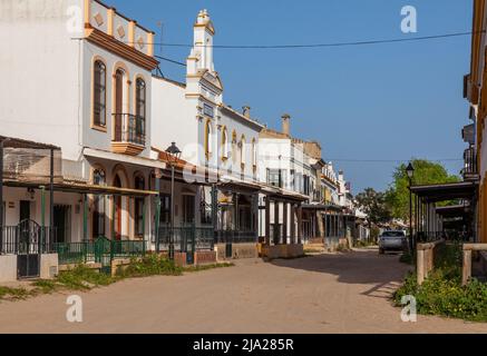 A sand street in the famous Andalusian 'Wild West' village of El Rocio, where all the streets are sand and many of the houses and bars have hitching p Stock Photo