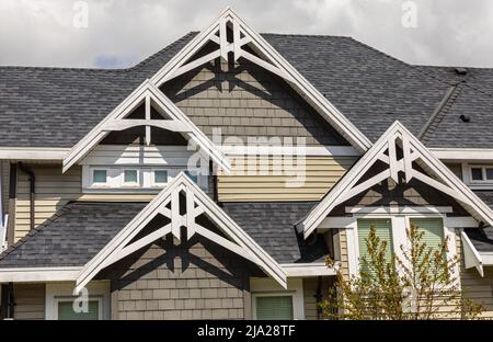 The roof of the house with details of exterior. Street view, nobody. Stock Photo