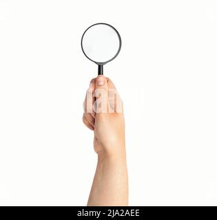 Magnifying glass in hand isolated on white Stock Photo