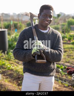 Portrait of american male gardener with shovel Stock Photo - Alamy
