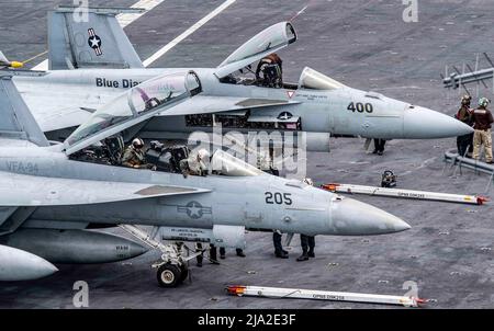 220526-N-MJ302-1049 PACIFIC OCEAN (May 25, 2022) Two F/A-18E Super Hornets, from carrier airwing (CVW) 17, prepare for flight operations aboard the aircraft carrier USS Nimitz (CVN 68) Nimitz is underway in the U.S. 3rd Fleet area of operations. (U.S. Navy photo by Mass Communication Specialist 3rd Class David Rowe) Stock Photo