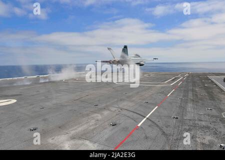 220525-N-DU622-2179 PACIFIC OCEAN (May 25, 2022) An FA-18F Super Hornet, from the 'Mighty Shrikes' of Strike Fighter Squadron (VFA) 94, launches off of the flight deck of the aircraft carrier USS Nimitz (CVN 68). Nimitz is underway in the U.S. 3rd Fleet area of operations. (U.S. Navy photo by Mass Communication Specialist 3rd Class Justin McTaggart) Stock Photo