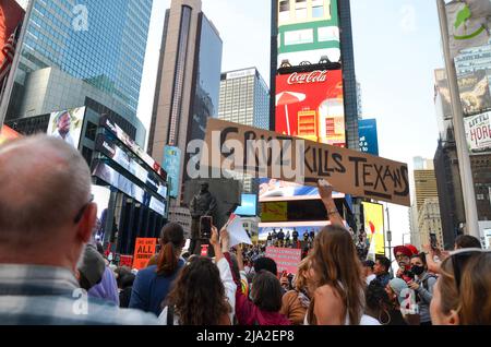 New York, New York, USA. 26th May, 2022. March participants are seen holding signs at Times Square, New York City to demand better gun laws and to ask everyone to come out as a gun violence prevention advocate on May 26, 2022. (Credit Image: © Ryan Rahman/Pacific Press via ZUMA Press Wire) Stock Photo
