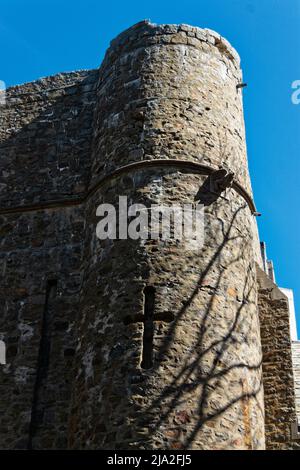 A stone castle tower with cross visible in the lower third at the 1926 Medieval-style Hammond Castle built by John Hays Hammond Jr. Gloucester, Massac Stock Photo