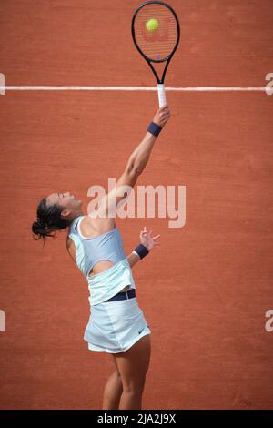 Paris, France. 26th May, 2022. Zheng Qinwen serves during the women's singles second round match between Zheng Qinwen of China and Simona Halep of Romania at the French Open tennis tournament at Roland Garros in Paris, France, on May 26, 2022. Credit: Meng Dingbo/Xinhua/Alamy Live News Stock Photo