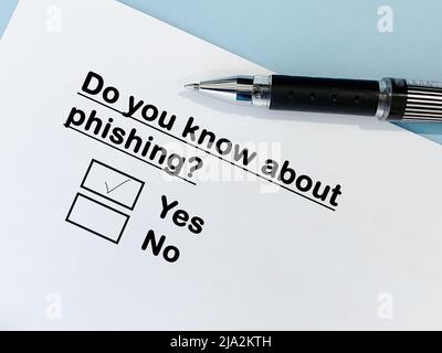 One person is answering question about scam and fraud. He knows about phishing. Stock Photo