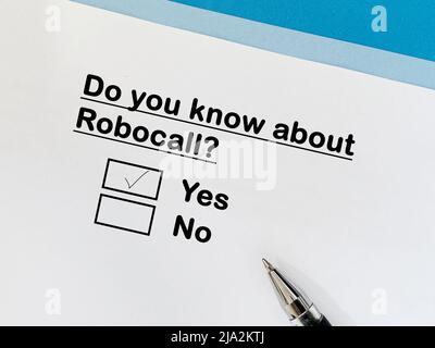 One person is answering question about scam and fraud. He knows about Robocall. Stock Photo