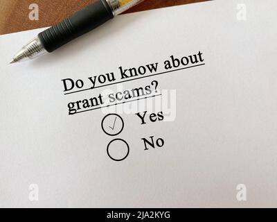 One person is answering question about scam and fraud. He knows about grant scams. Stock Photo