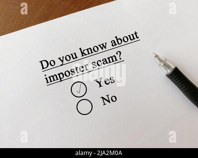 One person is answering question about scam and fraud. He knows about imposter scam. Stock Photo