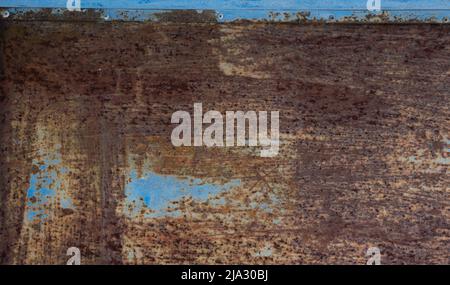 Corroded and rusted blue sheet of metal Stock Photo