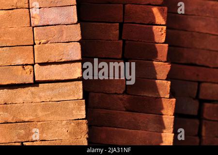 Pile of red bricks texture pattern background Stock Photo