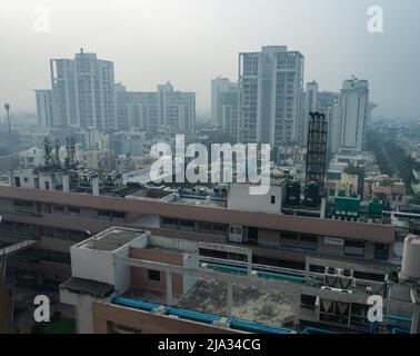 A cityscape morning view at Baani Square shows very poor visibility due to increased air pollution. Stock Photo