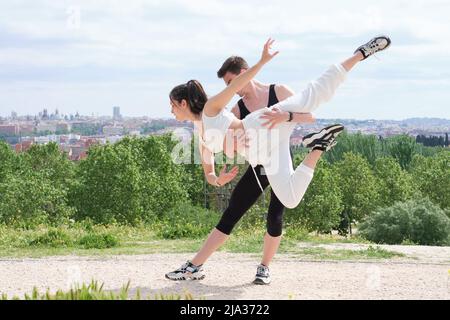 Young couple practicing street dance, ballet, dancing steps, movements. Stock Photo