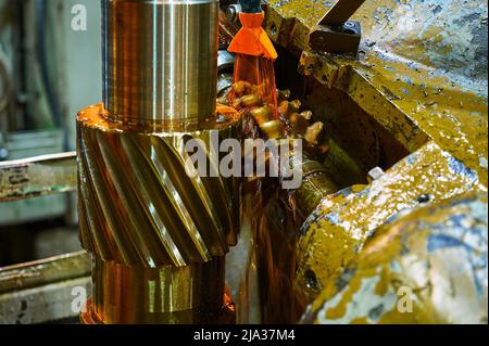 Processing helical gear with old modular hob machine tool Stock Photo