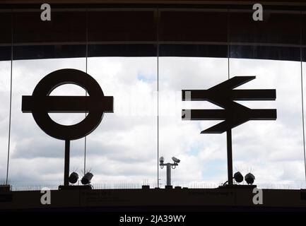 British Rail double arrow & Transport for London underground roundel logos in the front entrance to Abbey Wood Crossrail Elizabeth Line Station Stock Photo