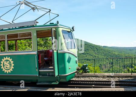 Königswinter, Germany- May 18, 2022 : View of the vintage green tram train in Drachenfels Germany Stock Photo