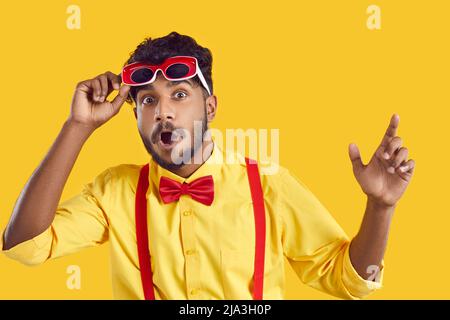 Amazed excited funny indian guy looking at camera with surprised wow face expression. Stock Photo
