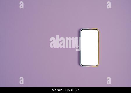 Mockup smart phone on purple background with copy space for your information content. Stock Photo