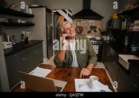 Caucasian elderly male on business call Stock Photo