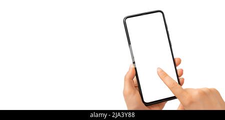 Female hand holding black cell phone smartphone with blank white screen and modern design isolated on white background. Mockup phone. Woman's Hand Hol Stock Photo