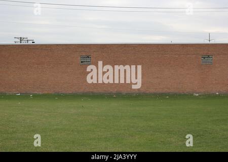 Typical brick wall of a common warehouse. Stock Photo