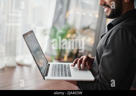 cropped image of a business man using a laptop. Stock Photo