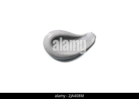 Charcoal, gray clay whitening toothpaste, cosmetic mask or peeling gel texture swatch isolated on white background. Stock Photo