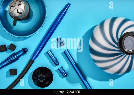 Top view of Hookah parts on light blue background Stock Photo