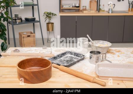 Tray with raw Christmas cookies, three eggs, rolling pin, flour and cutters Stock Photo