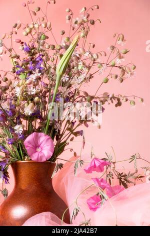 Still life with blossom sage and wildflowers in pink tones Stock Photo