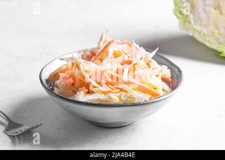 Coleslaw Salad. Organic Cabbage ans Carrots salad - healthy diet, detox, vegan, vegetarian, vegetable spring salad close up. Stock Photo