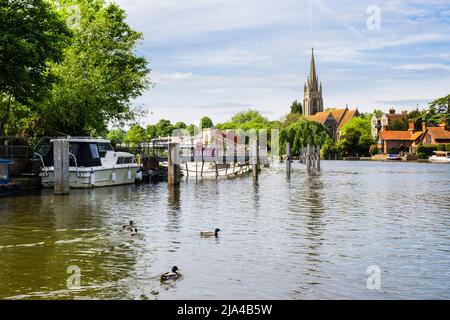 View from Marlow lock along River Thames to weir and All Saints Church in the town of Marlow, Buckinghamshire, England, UK, Britain