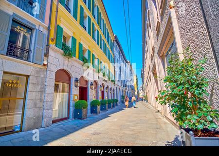 MILAN, ITALY - APRIL 5, 2022: Via della Spiga is a part of Fashion district of Milan with exclusive boutiques and jewelers, on April 5 in Milan, Italy Stock Photo