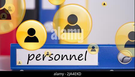 Image of icons floating over binder with personnel Stock Photo