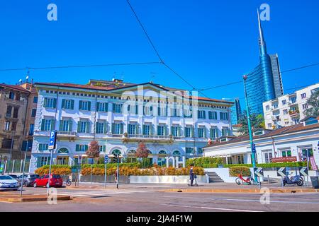 MILAN, ITALY - APRIL 5, 2022: The scenic facade of nh hotel Palazzo Moscova anf the Unicredit tower on background, on April 5 in Milan, Italy Stock Photo