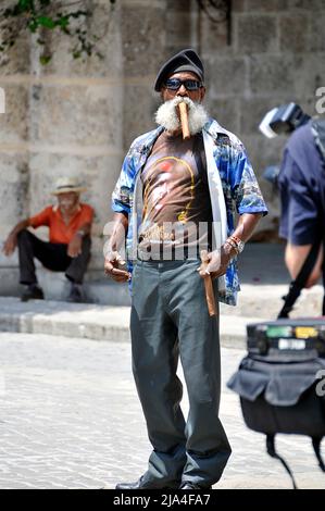 Bearded old cuban man smoking a big cigar, Cathedral Plaza, historic old town of Havana, Cuba, Caribbean Stock Photo