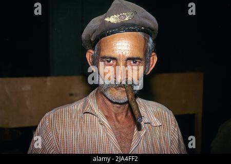 Old bearded cuban man smoking a cigar, cigar factory at Pinar del Rio, Cuba, Caribbean Stock Photo