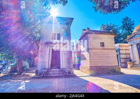 MILAN, ITALY - APRIL 5, 2022: The historical funeral tombs in Monumental Cemetery, on April 5 in Milan, Italy Stock Photo