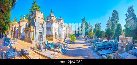 MILAN, ITALY - APRIL 5, 2022: Panoramic view on outstanding funeral tombs and mausoleums with sculptures, on April 5 in Milan, Italy Stock Photo